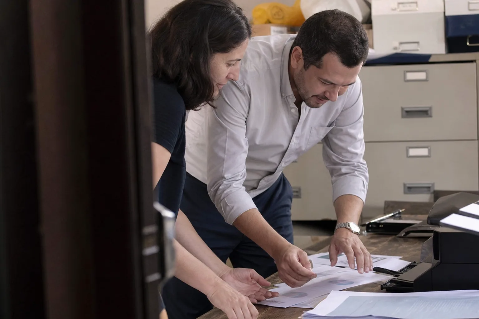 Customer team celebrating quietly as a first report comes out of the new system